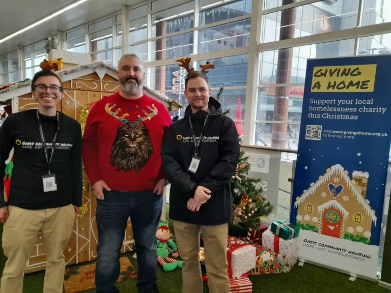 Smart IT team volunteering for Christmas charity event at a community centre.