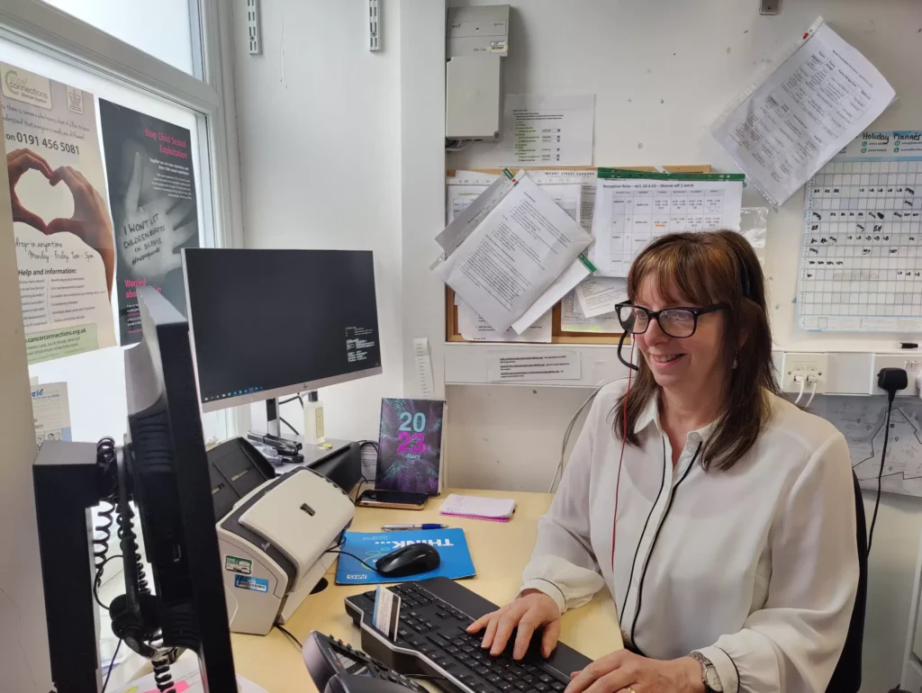 Office worker using computer at Smart IT in Imeary Street Surgery.