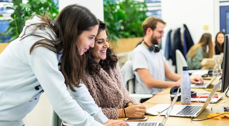 Diverse team working together at Smart IT office.